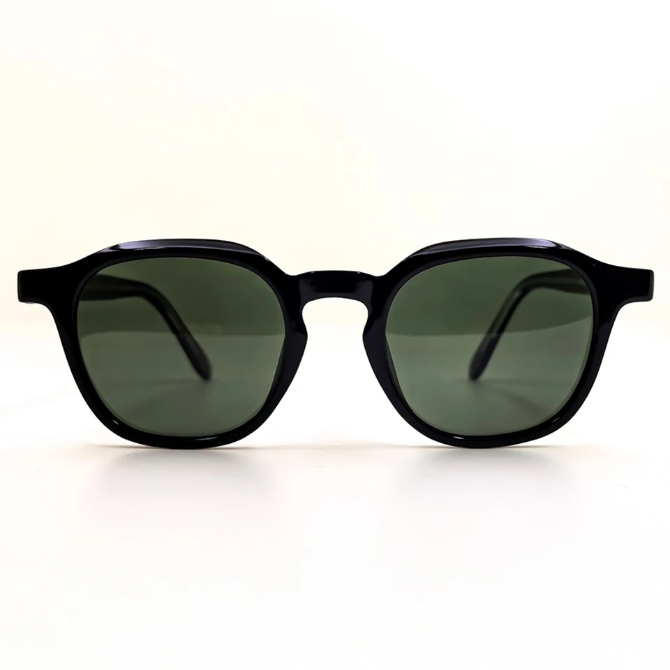 Black keyhole bridge sunglasses with green polarized lenses, temples folded